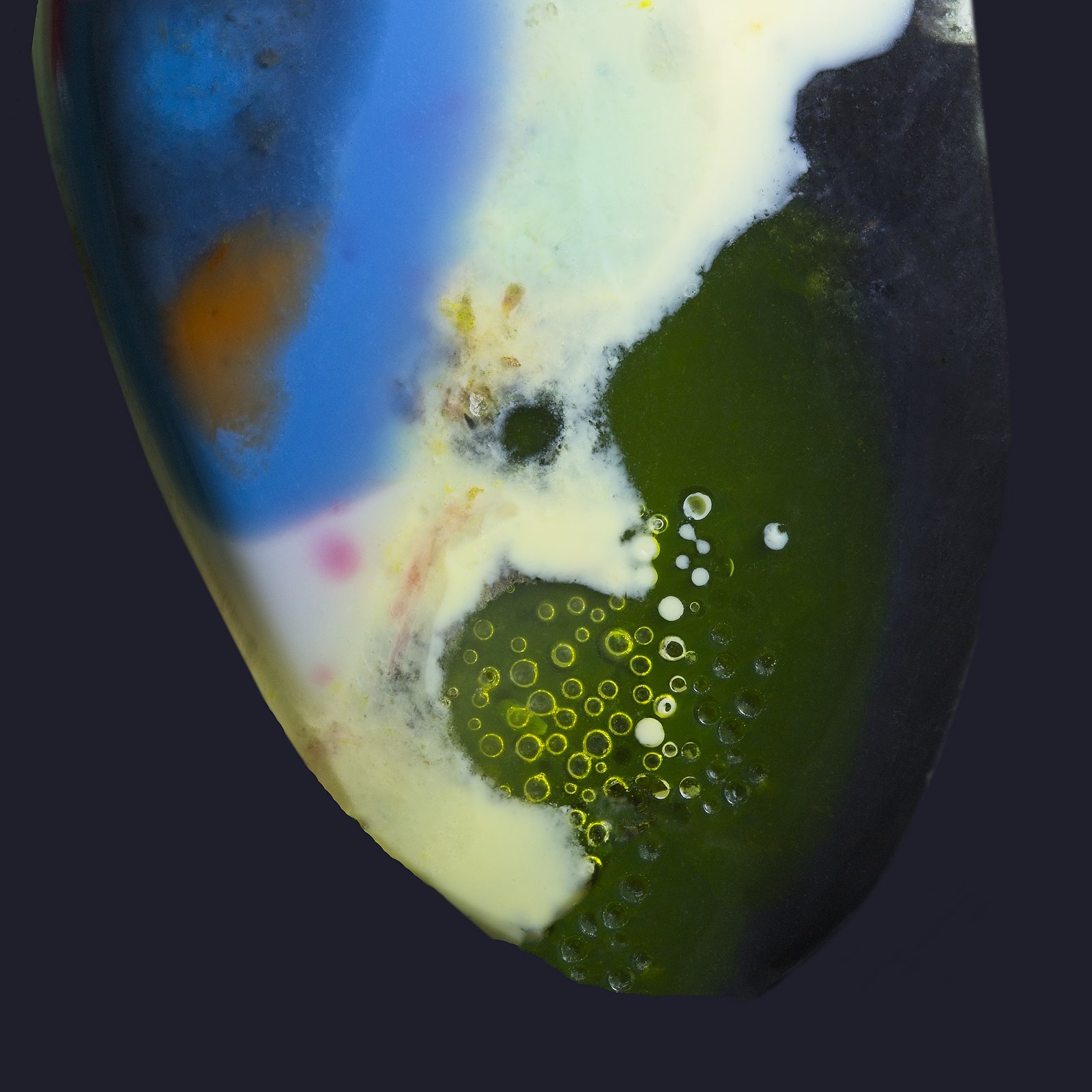 Surfite is a unique material created from industrial waste generated during the manufacturing of surfboards. Layers of resin accumulate on the workshop floor during the surfboard crafting process and then this excess material is collected. Instead of ending up in a landfill, these colorful resin layers are salvaged and transformed into something beautiful. Wearing Surfite jewelry is a statement of style and sustainability.