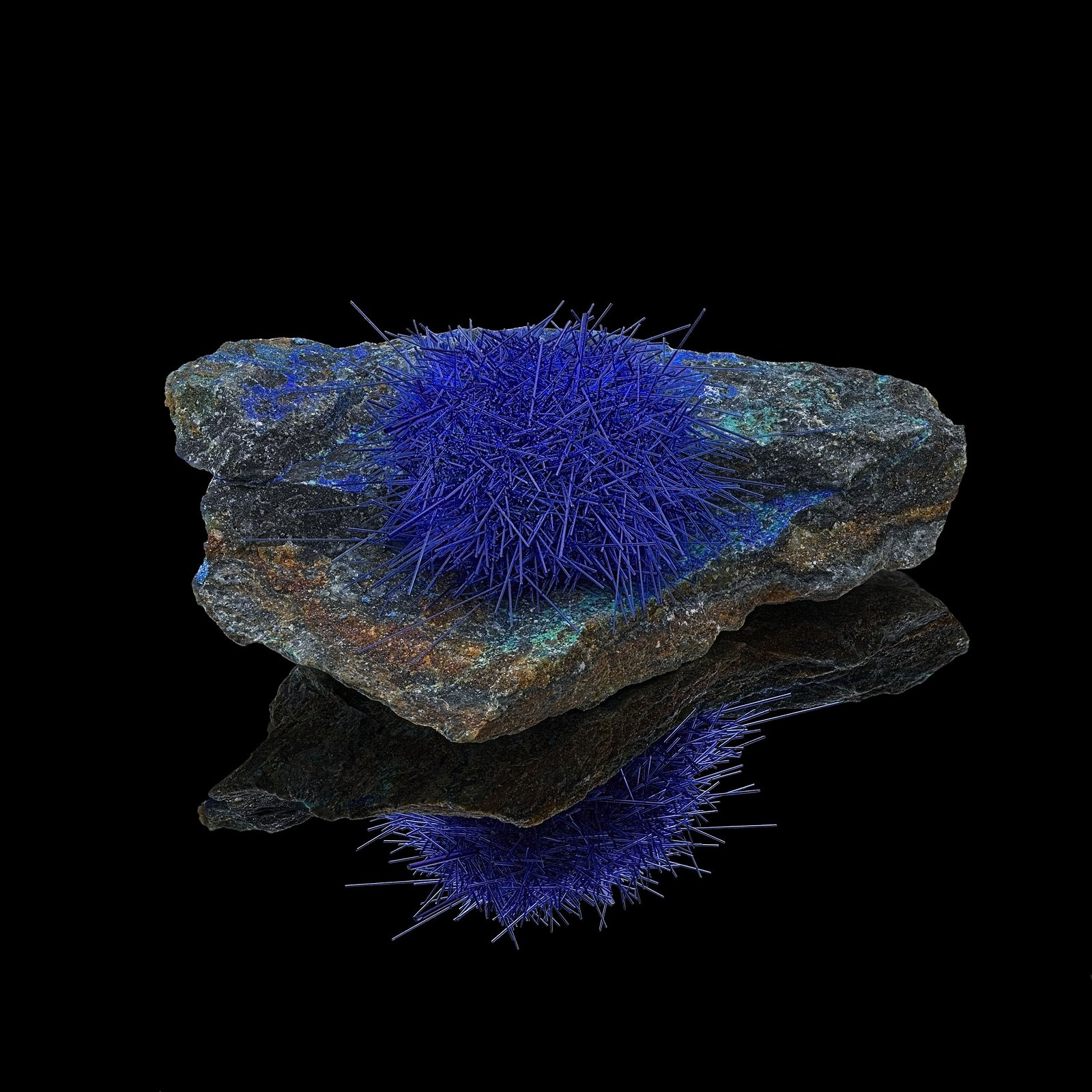This is a man made crystal that had been grown on the rock in a lab. I had purchased it online and thought that it was a very beautiful crystal growth. After I received it and then doing research found out that these types of specimens are produced in China. It may not be natural but it still is beautiful.