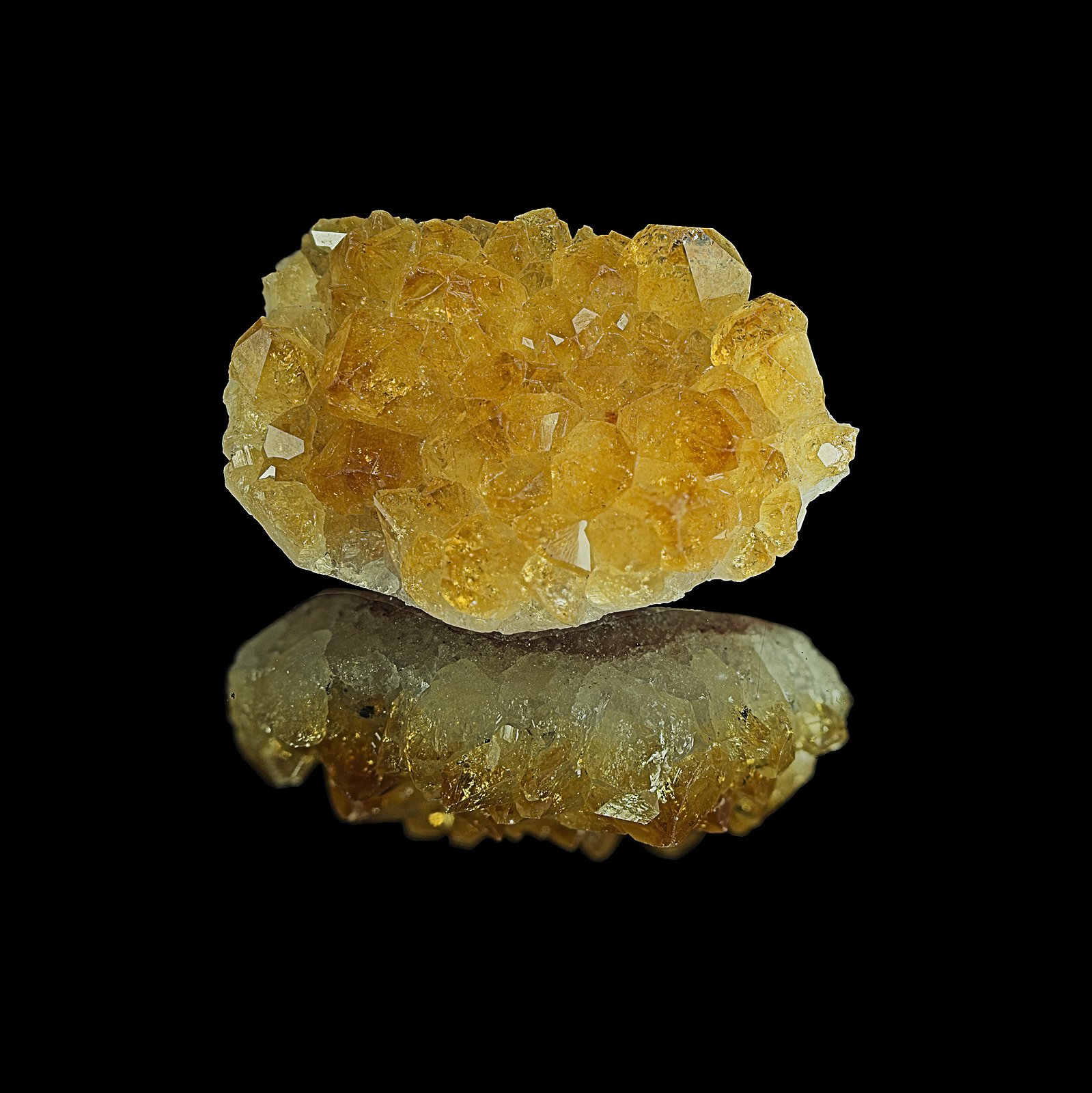 Citrine is a transparent, yellow variety of quartz. Its name is derived from the Latin word citrus (citron tree), by way of the French citrin or citron (lemon). Citrine is one of the most popular yellow gemstones and has been used since ancient Egyptian times. There is disagreement as to which trace elements are responsible for its color. Not all yellow quartz is considered citrine, such as quartz stained by iron inclusions or coatings. Natural citrine is rare; most commercially available "citrine" is produced by heating amethyst or smoky quartz.