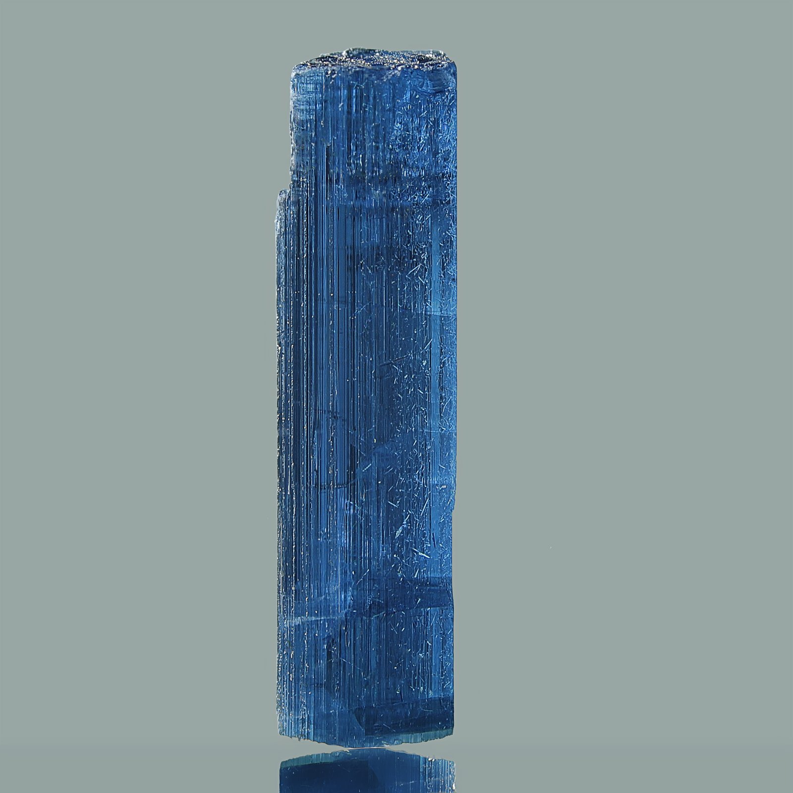 A single 1.5 blue indicolite Tourmaline Crystal from Himalayan Mountains. Indicolite, also known as Blue Tourmaline, is a very rare complex magnesium iron boro-aluminium silicate hydroxide mineral. This Tourmaline variety gets its color from tiny iron impurities and has only a few known localities throughout the world. 