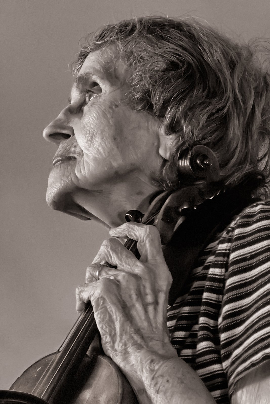 Mary Jo Briggs was an accomplished violin player and this photo was taken when she was 95 years old. She practiced every day because she loved playing it. 